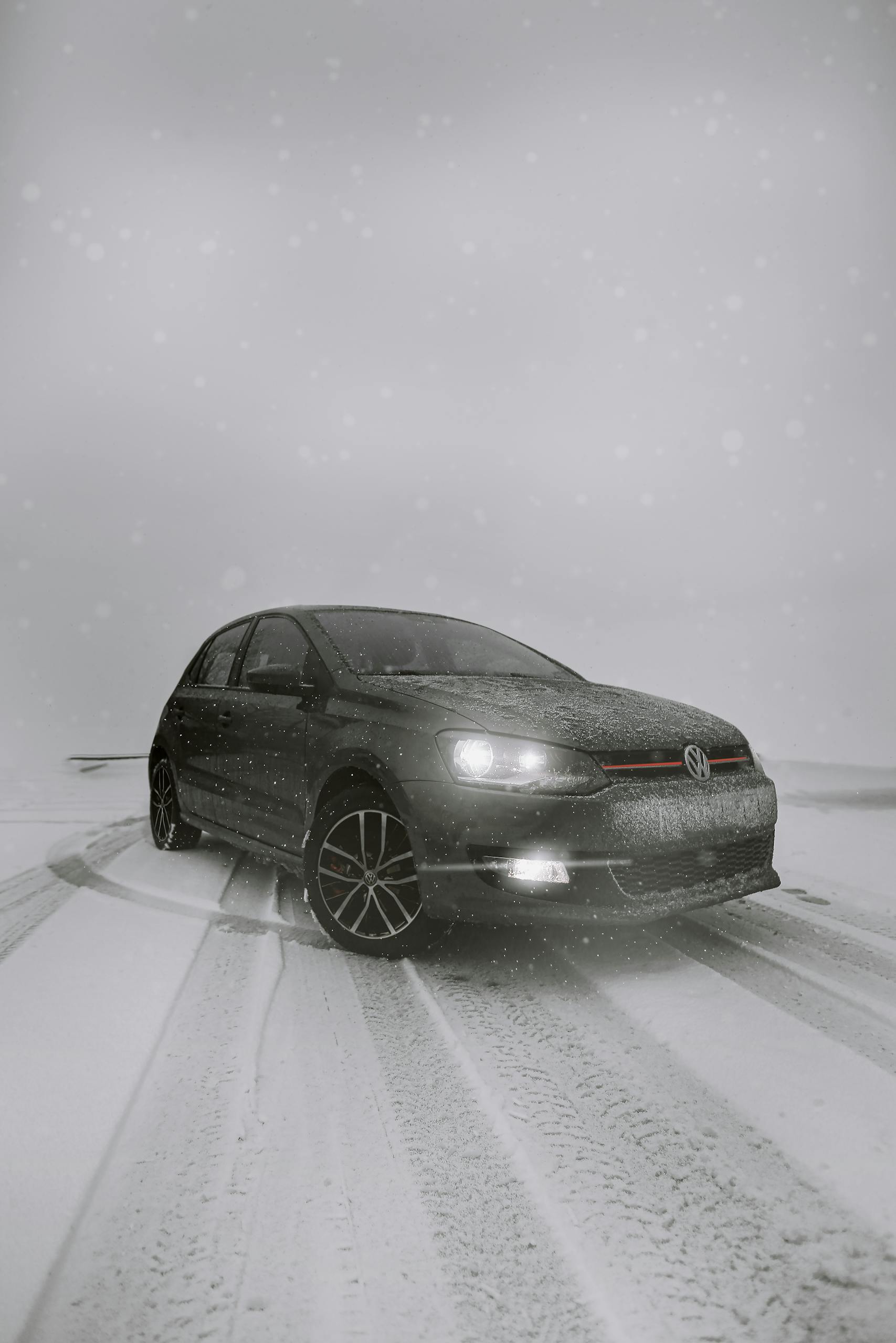 A car navigating through a snowy landscape, showcasing winter driving conditions and vehicle resilience.